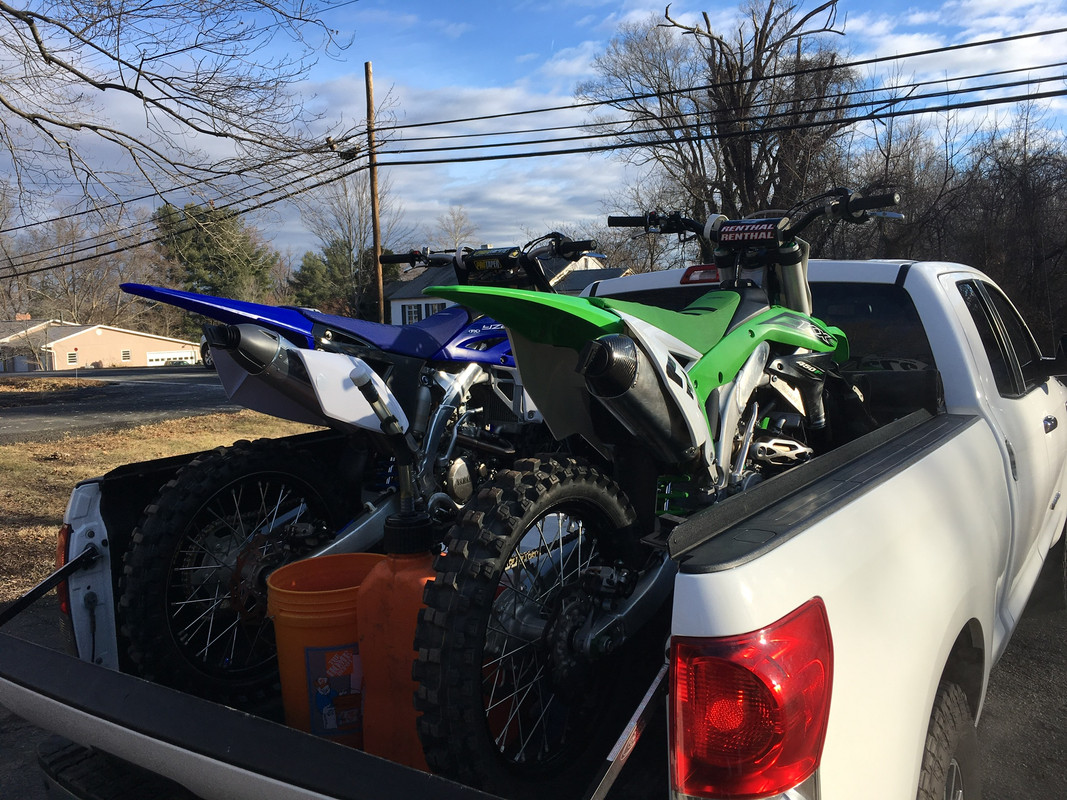 4 dirt bikes in a truck sales