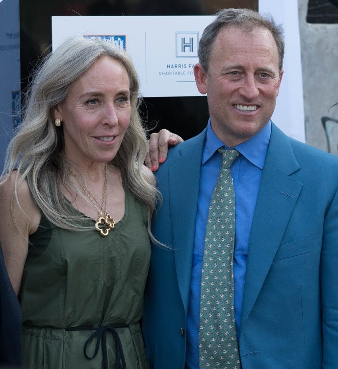 Joshua Harris and his wife Marjorie Rubin attending a program in Harris Family Charitable Foundation