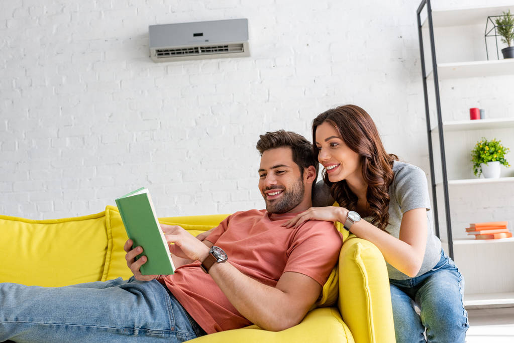 Man resting under working AC