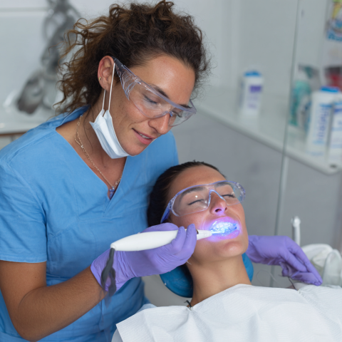 Clinicasmiling-Photo-of-a-dental-professional-applying-a-white-fa411213-8fdc-455b-b3c2-e4736434b13b