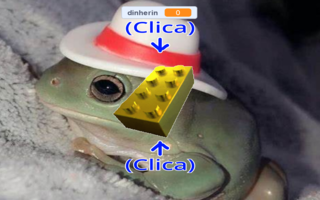 Screenshot of the game, in which we can see a golden brick with some blue arrows pointing to it and a frog with a hat as the background.