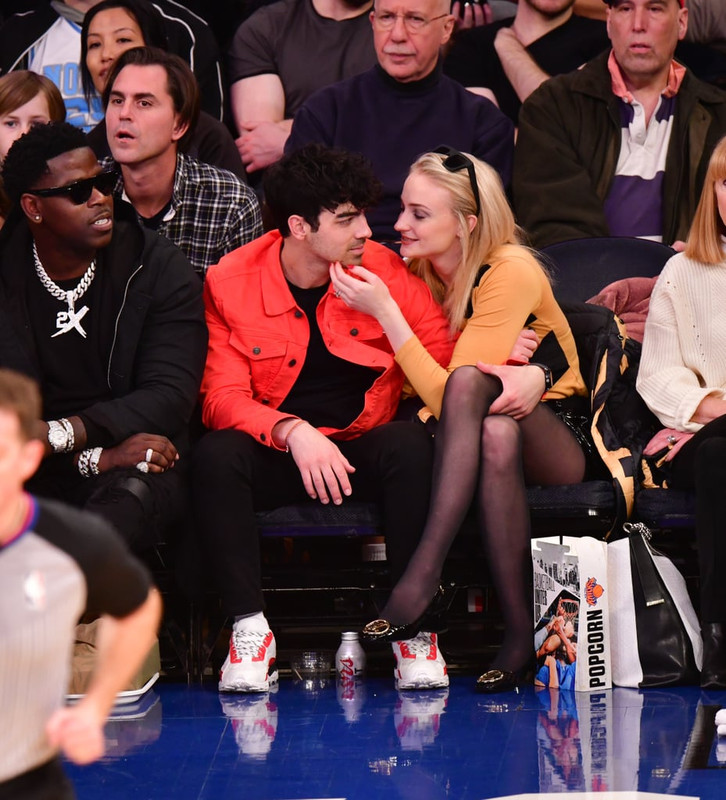 Sophie-Turner-Crossed-Legs-in-Pantyhose-Attend-sacramento-king