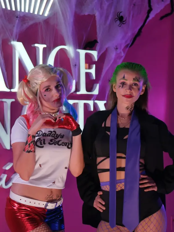 Two friends in matching villain costumes