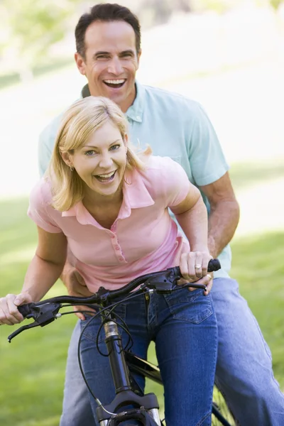 depositphotos-4764024-stock-photo-couple-one-bike-outdoors-smiling