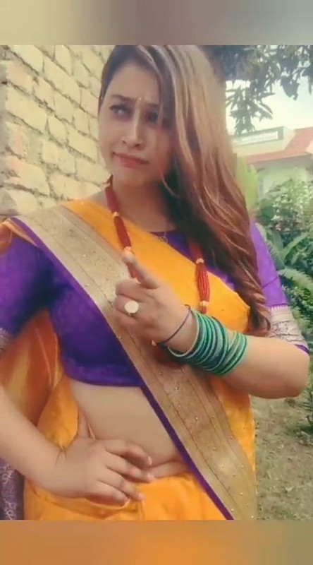 Beautiful Nepali Aunty Sexy open Big Deep Navel in Orange Saree.mp4_snapshot_00.00.616