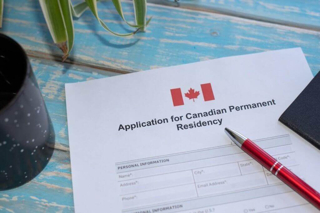 Canadian application documents arranged on a desk