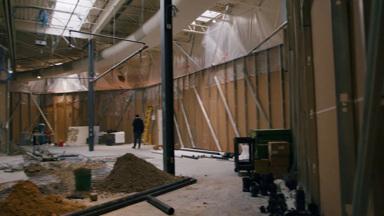 Starbucks space during construction with steel framing and open ceiling