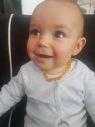 happy-baby-with-his-amber-teething-necklace