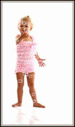 cute-toddler-in-her-baby-pink-smitten-lace-romper