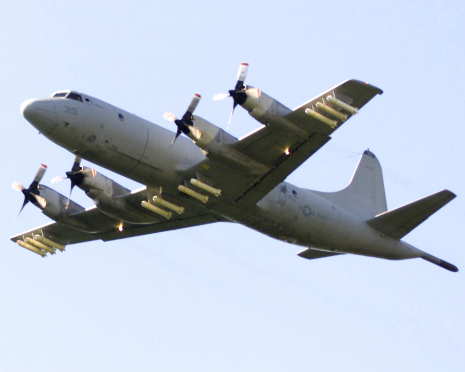 Lockheed-P-3C-Orion-of-VP-8-heads-to-a-bombing-exercise-loaded-with-MK-20-Rockeye-cluster-bombs-on.jpg