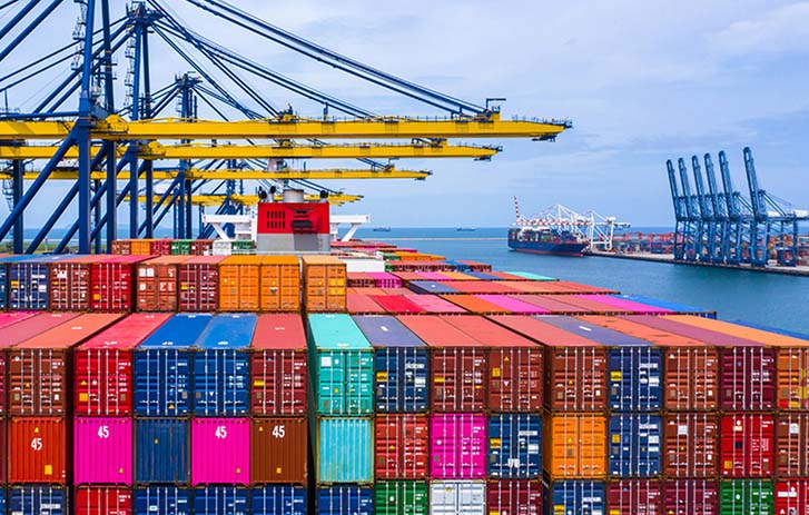 Cargo port terminal with container stack and cranes