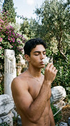 Man-smelling-flower-202604080718-2