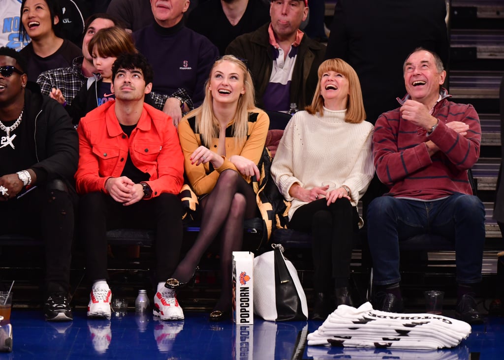 Sophie-Turner-Crossed-Legs-in-Pantyhose-Attend-sacramento-king