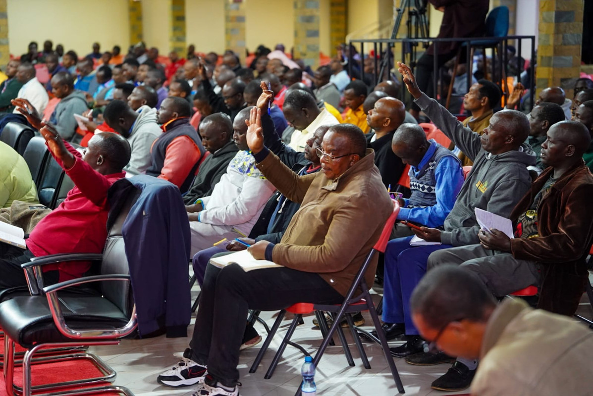 A group of men studying the bible together.