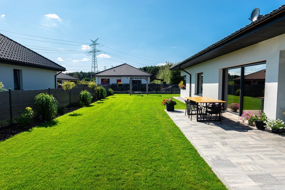 A well-maintained home showcasing a healthy lawn and bright exterior.
