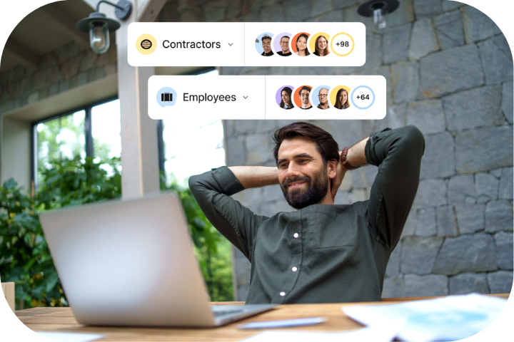 Two coworkers chatting in a conference room while seated