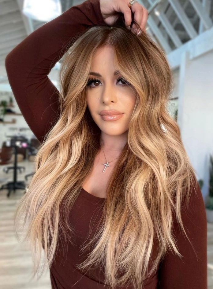 Honey light blonde hair with red roots