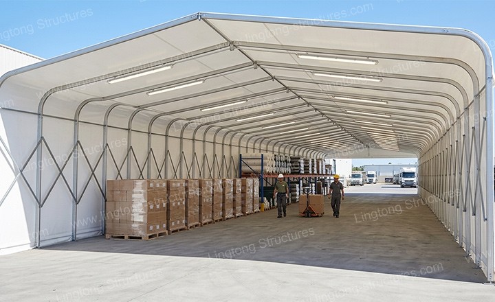 Retractable tunnel tent used for temporary material storage in an industrial yard
