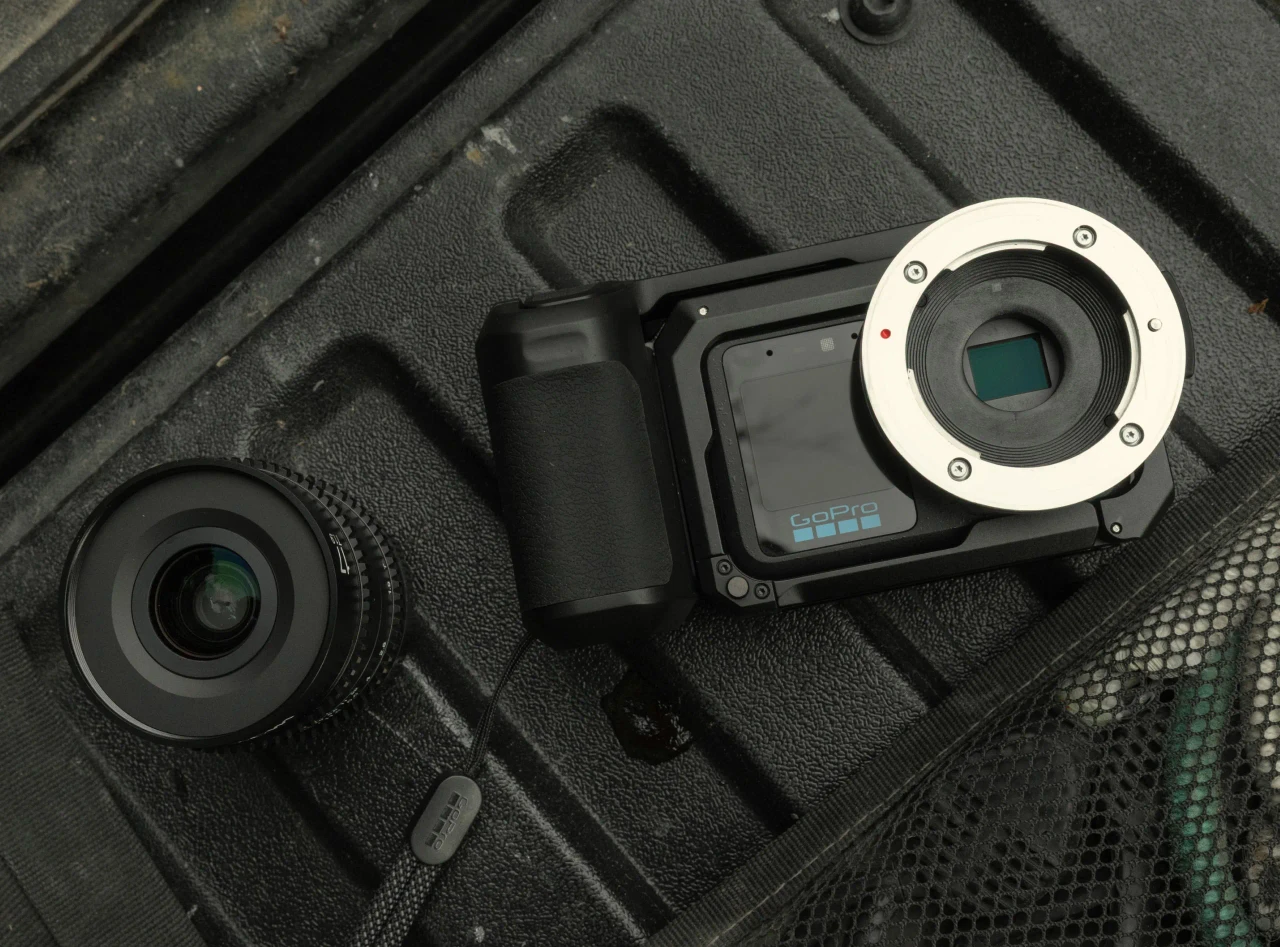 GoPro MISSION 1 PRO ILS body with a Micro Four Thirds cine lens beside it