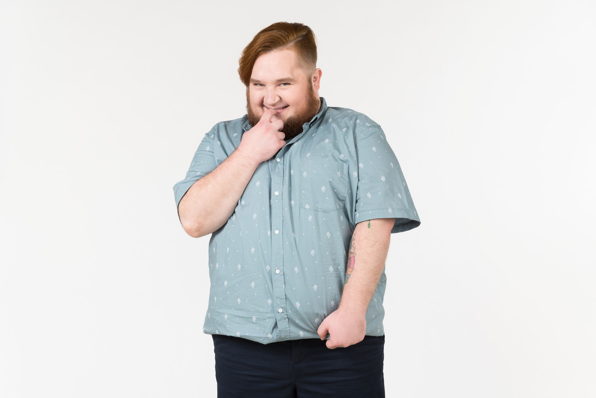 a-fat-man-smiling-shyly