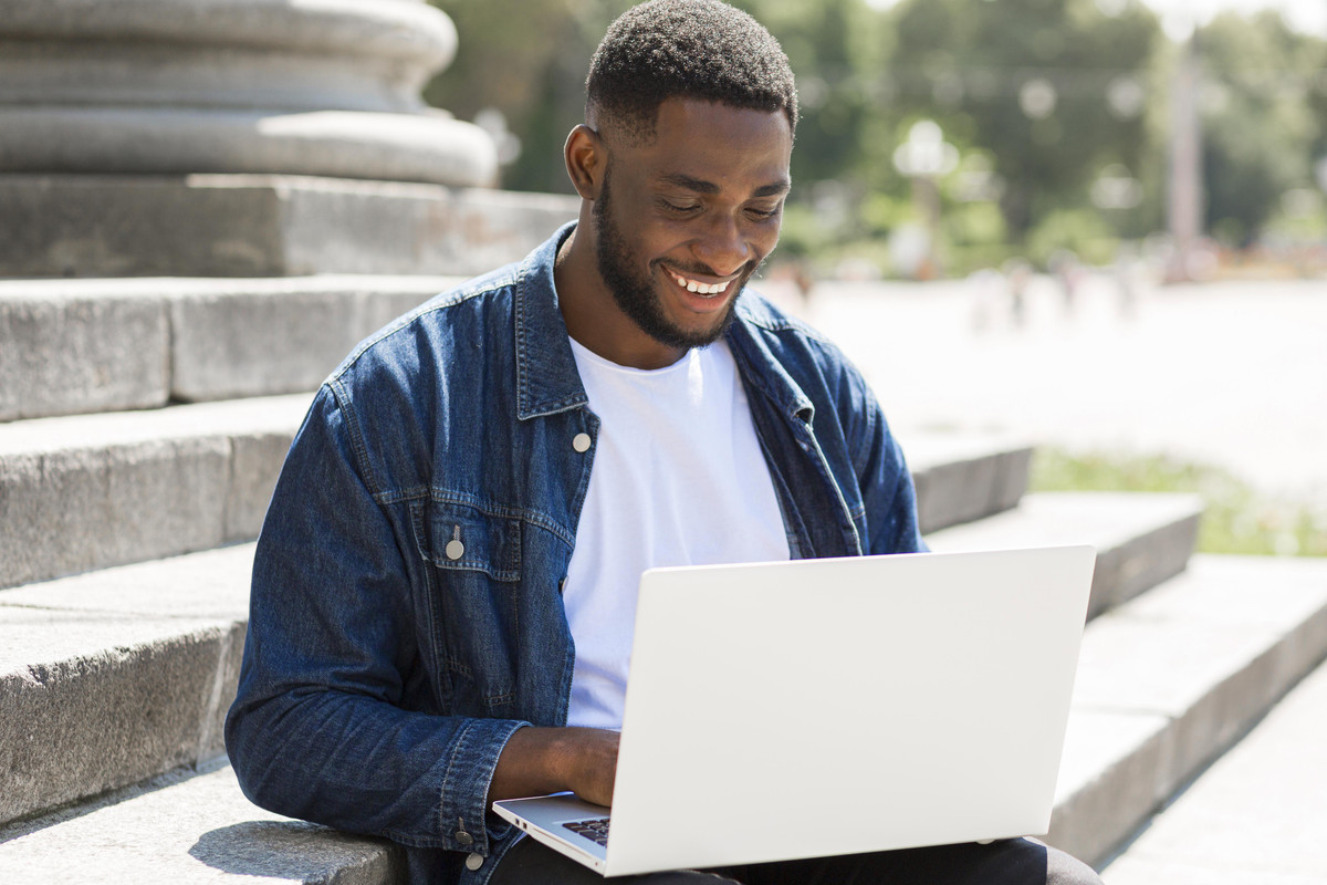 A student working successfully at a modern remote job