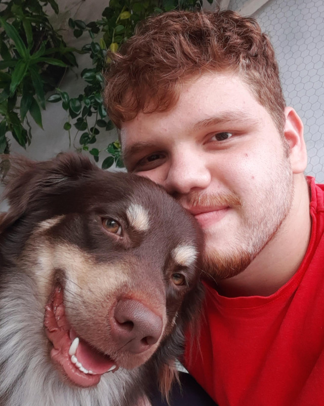 Pet owner with their pet during a grooming or at-home care moment