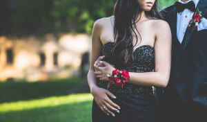 Prom photo, couple has boutonnierre and corsage