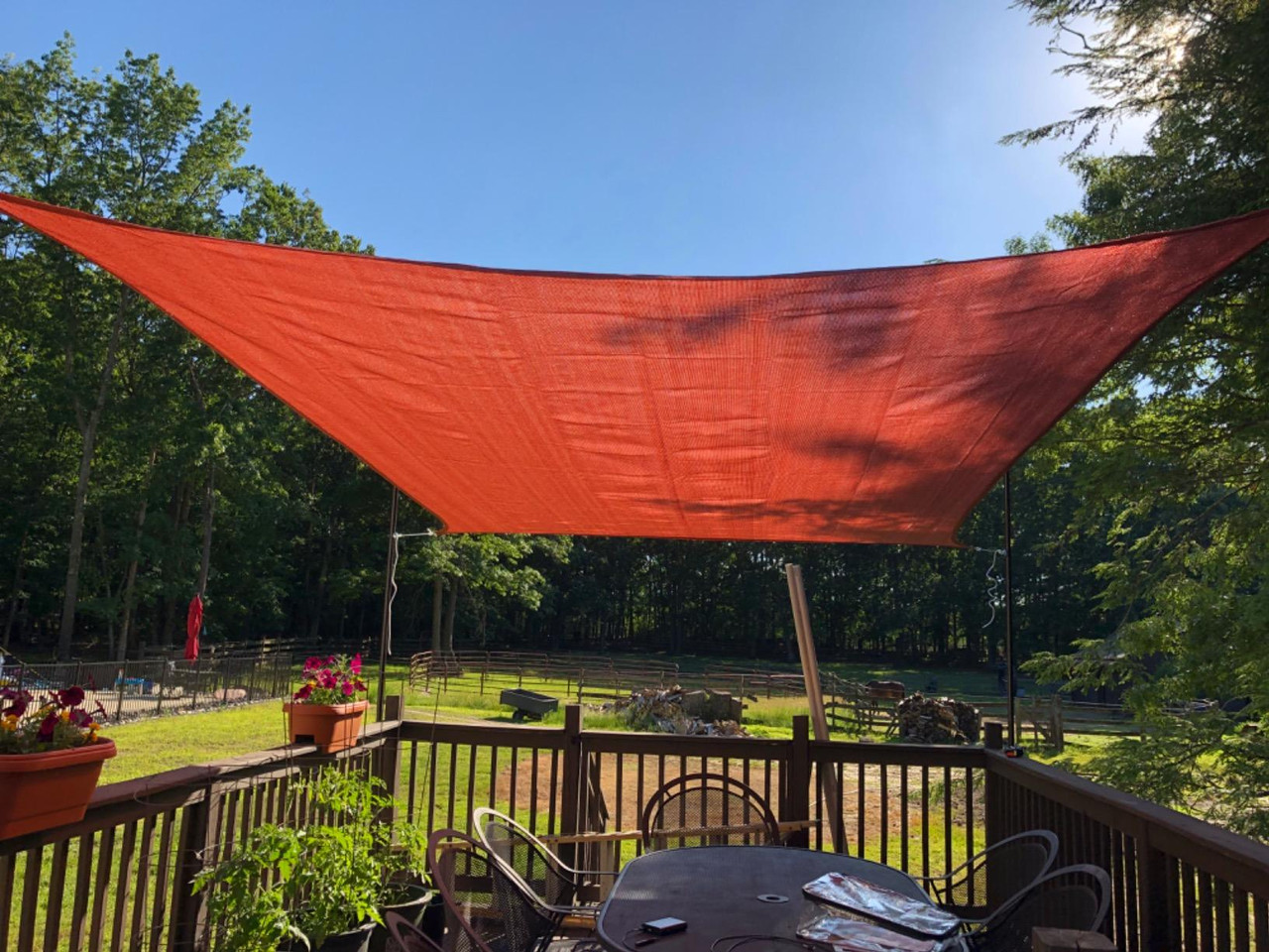 Red Shade Cloth installed in outdoor kitchen area by CIKALA