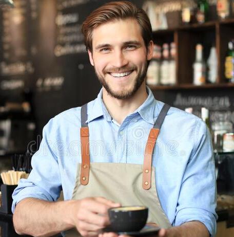 handsome-barista-offering-cup-coffee-to-