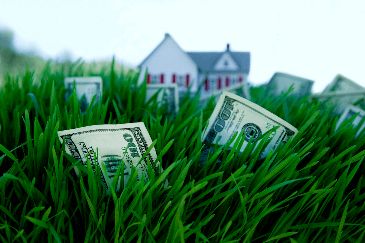 graphic of hand holding miniature house