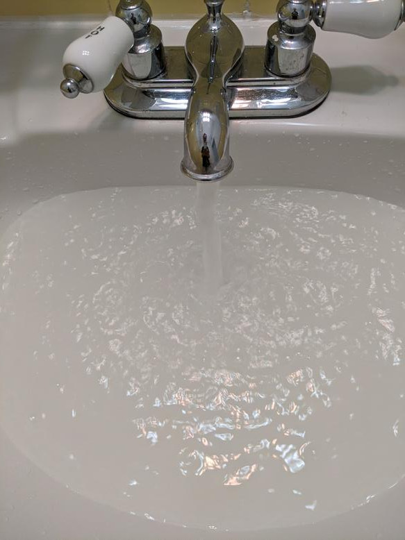 Cloudy hot water coming from one faucet