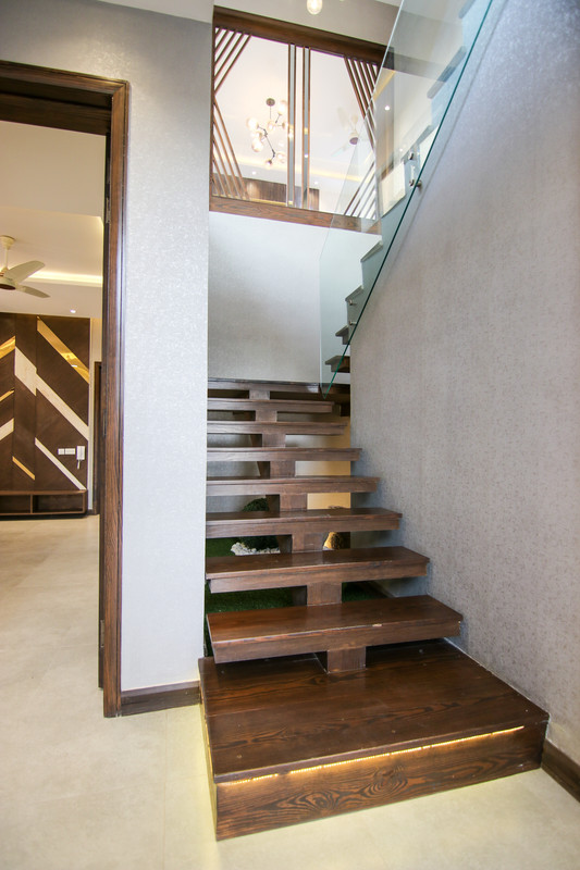 Modern Straight Staircase Design with Wood, Concrete, and Glass
