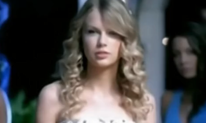 Gorgeous Babe In A White Dress Proudly Displaying Her Breasts.