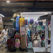 a front of a shop, kebaya dresses filling the space
