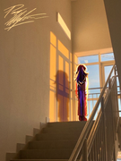 digital art of a girl with dark brown hair in a white dress shirt and red pants standing with her back turned towards the viewer in an empty staircase at sunset.