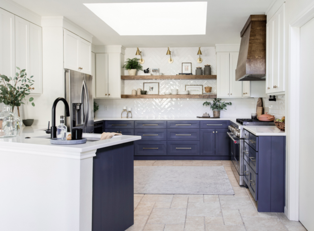 Industrial style kitchen with exposed brick and metal accents
