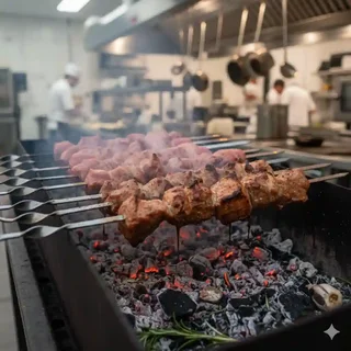 The Ageno grill with glowing charcoal