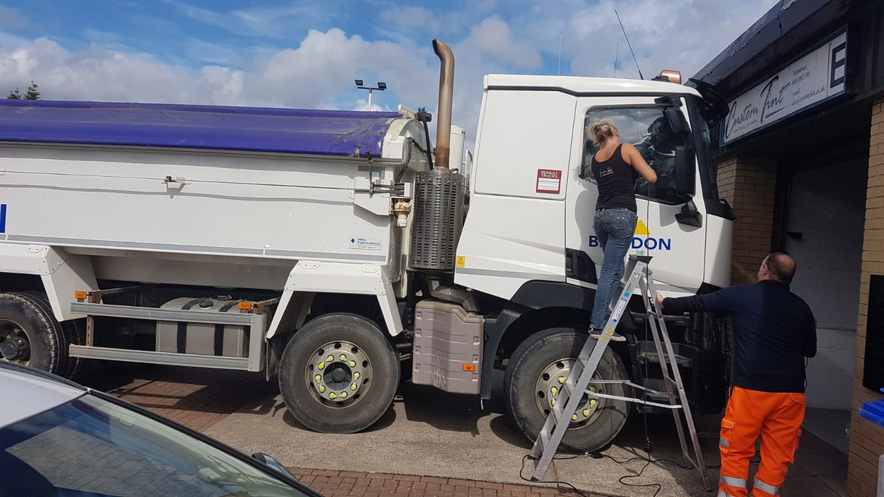 Professional driver having vehicle window film installed