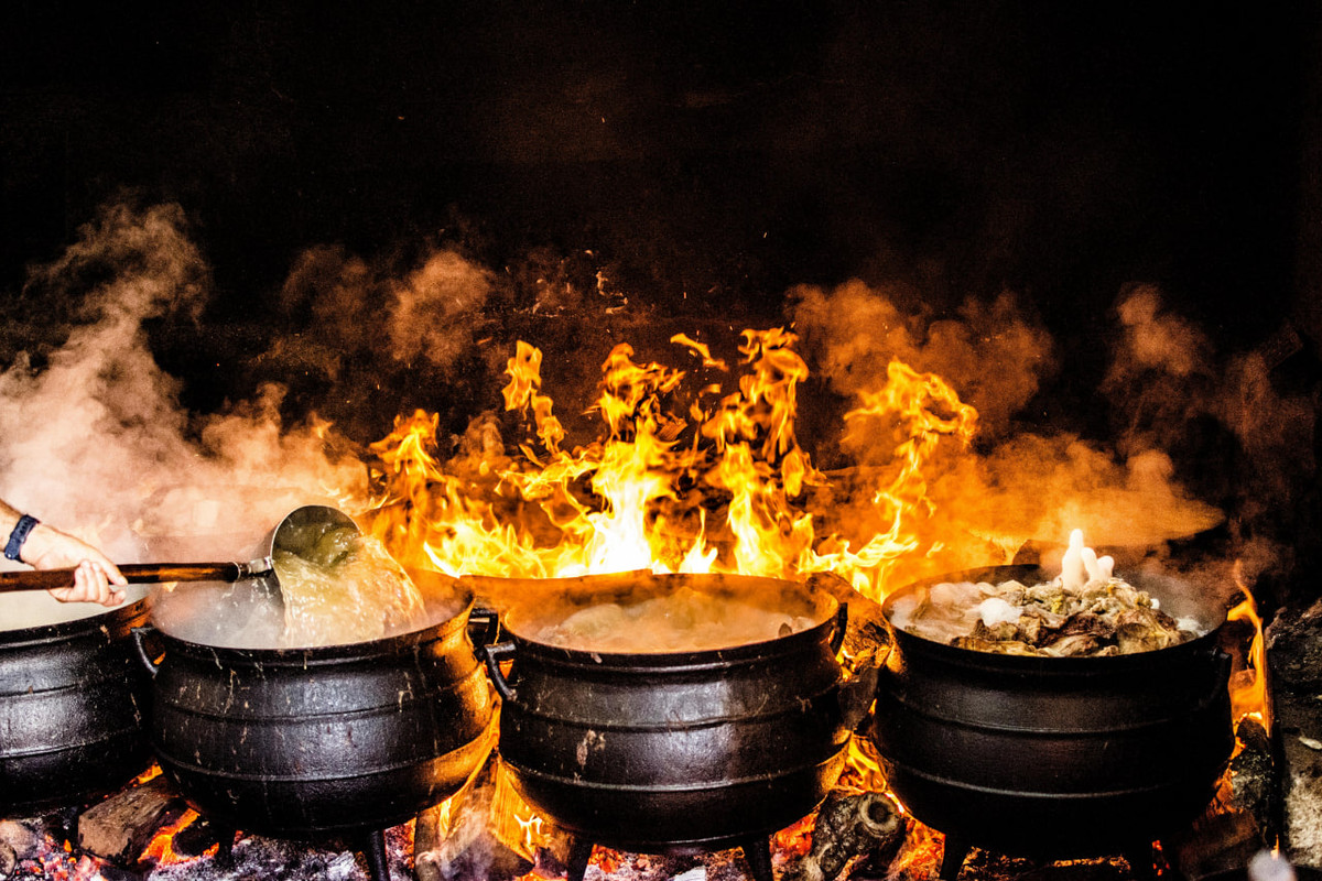 Metal pots on an open fire for cooking