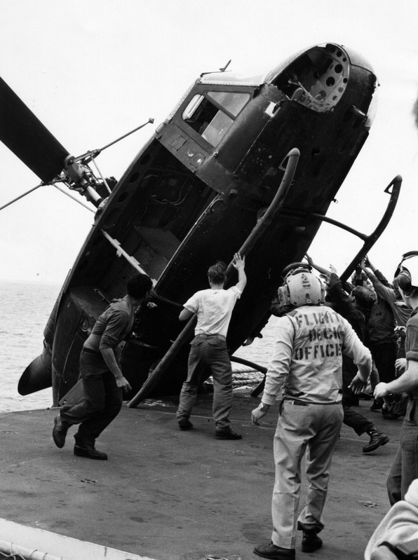 South-Vietnamese-helicopter-is-pushed-over-the-side-of-the-USS-Okinawa-during-Operation-Frequent-Win.jpg