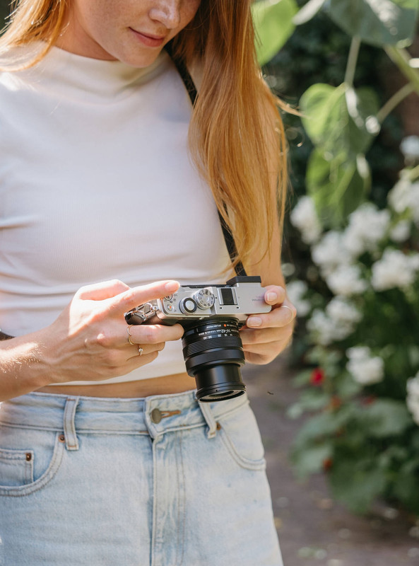 OM SYSTEM PEN Mirrorless Camera lifestyle shot