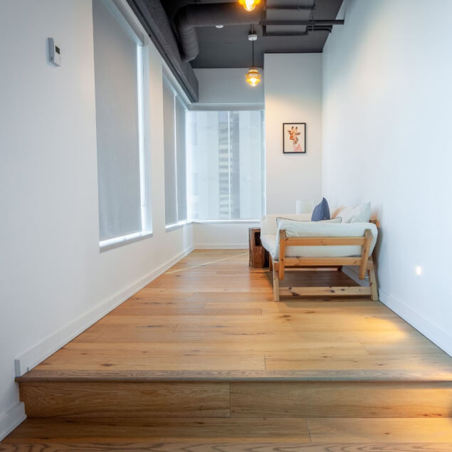 Hallway with comfortable looking couch