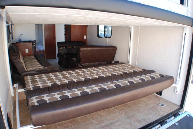 Toy_Hauler_24ft_Interior_Rear_Bed_Setup_Reversible_Couch_2