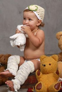 cute-baby-in-her-cream-smitten-cloche-beanie-and-huggalugs-cream-ruffled-legwarmers