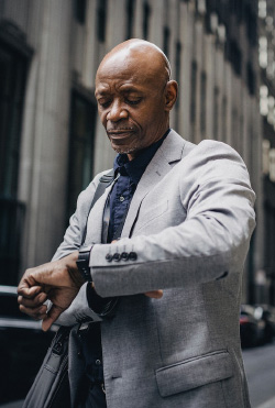 a businessman looking at watch