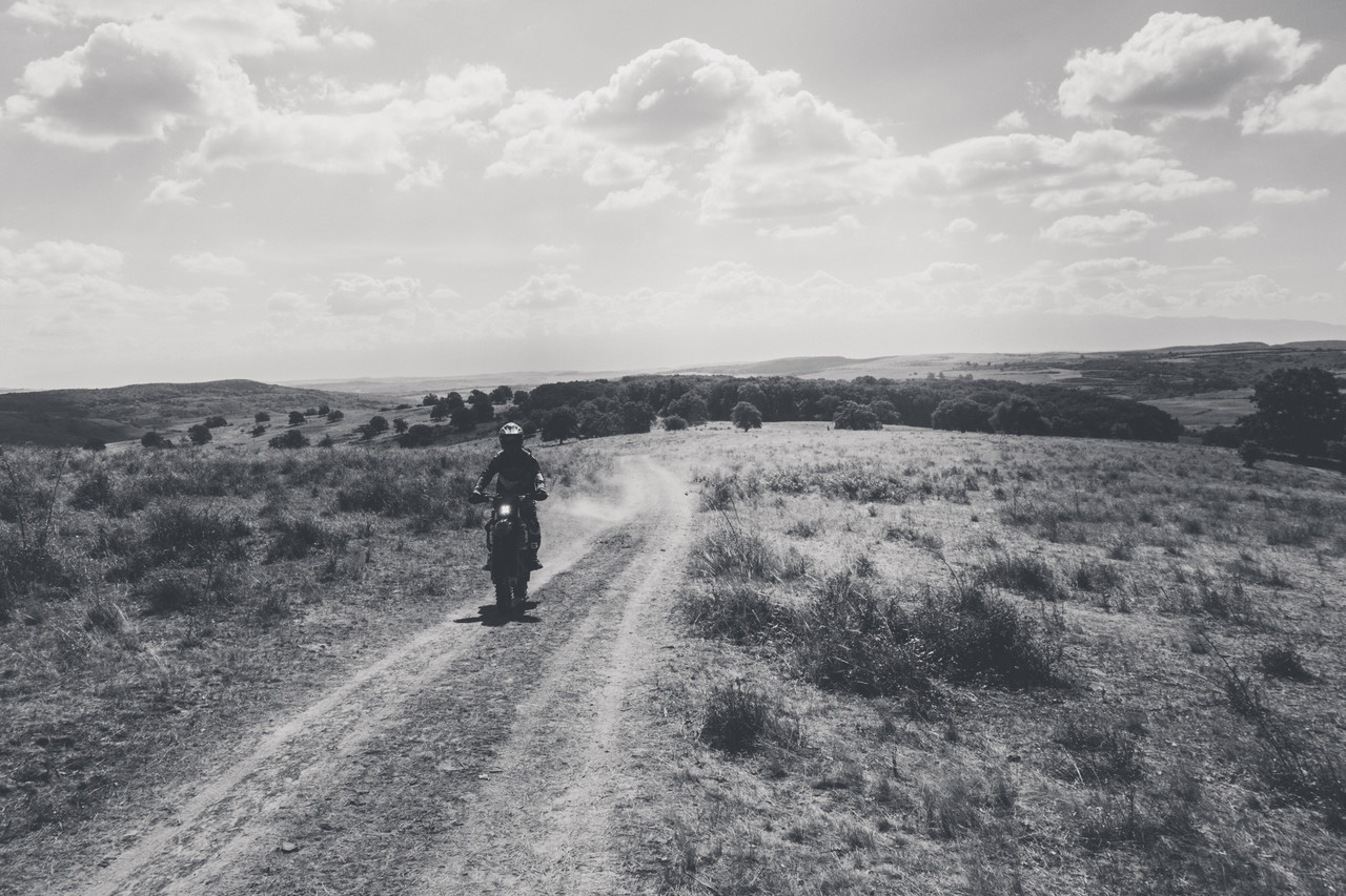 Enduro rider following a trail