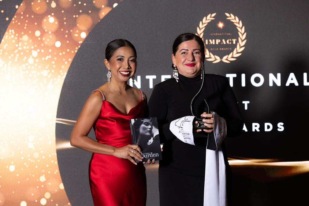Natia posing with the first place award at the Gala Awards ceremony held in Phoenix, Arizona.