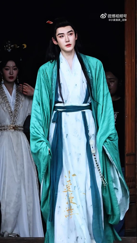 Filming with a new character, possibly Ah Xian who had saved him earlier.