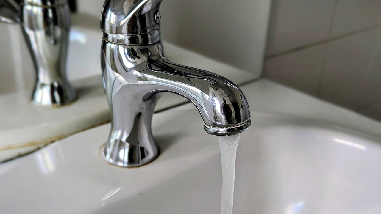 Close-up of a leak needing urgent fixture repair