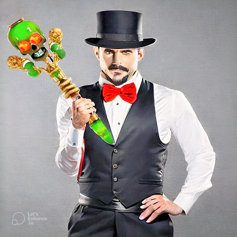 Billmoore Maglimar, dressed in vest and top hat, holding the powerful magic staff of Igviz, topped with a green skull with glowing ruby eyes 